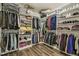 Spacious walk-in closet offering ample storage space with custom shelving and clothing racks at 465 Gianna Dr, Clayton, NC 27527