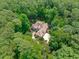 Aerial view of estate-style home with mature trees providing privacy and landscaping at 4905 Ivercroft Pl, Fuquay Varina, NC 27526