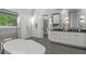 Luxurious bathroom features a soaking tub, walk-in shower, and double vanities with great counter space at 4905 Ivercroft Pl, Fuquay Varina, NC 27526