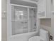 Bright bathroom features a shower with sliding glass door and white cabinet at 4905 Ivercroft Pl, Fuquay Varina, NC 27526