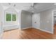 Bedroom with hardwood floors, window seat, a ceiling fan and double door closet at 4905 Ivercroft Pl, Fuquay Varina, NC 27526