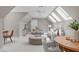 Bonus room featuring skylights, seating area and neutral color palette at 4905 Ivercroft Pl, Fuquay Varina, NC 27526