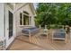 Spacious wood deck with comfortable outdoor seating and views of the lush backyard at 4905 Ivercroft Pl, Fuquay Varina, NC 27526