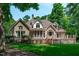 Brick home showcasing a well-manicured lawn and charming architectural details at 4905 Ivercroft Pl, Fuquay Varina, NC 27526