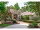Beautiful brick home featuring a red front door and well-maintained landscaping at 4905 Ivercroft Pl, Fuquay Varina, NC 27526