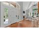 Elegant entryway with hardwood floors, soaring ceilings and a view of the living room at 4905 Ivercroft Pl, Fuquay Varina, NC 27526