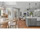 Open concept kitchen with granite counters, stainless appliances, eat-in table, and views to the Gathering room at 4905 Ivercroft Pl, Fuquay Varina, NC 27526