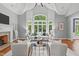 Bright living room with high ceilings, large windows, and stylish furniture at 4905 Ivercroft Pl, Fuquay Varina, NC 27526