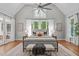 Spacious main bedroom with vaulted ceiling, large windows, and a cozy sitting area with bench at 4905 Ivercroft Pl, Fuquay Varina, NC 27526