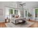 Spacious main bedroom with vaulted ceiling, large windows, and a cozy sitting area with bench at 4905 Ivercroft Pl, Fuquay Varina, NC 27526
