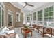 Inviting sunroom with brick walls, a skylight, lots of windows, and comfortable seating at 4905 Ivercroft Pl, Fuquay Varina, NC 27526