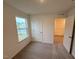 Bedroom with carpet and natural light near closet at 507 Eastwood St, Durham, NC 27704