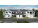 New townhomes with attached garages feature classic architectural details and neutral color schemes at 507 Eastwood St, Durham, NC 27704