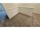 Upstairs hallway with plush carpeting and white trim at 507 Eastwood St, Durham, NC 27704
