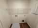 Laundry room features modern flooring and a utility sink at 507 Eastwood St, Durham, NC 27704
