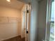Walk-in closet featuring wire shelving and neutral carpet at 507 Eastwood St, Durham, NC 27704