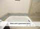 Relax in the bright soaker tub with tiled detailing and modern fixtures at 511 Hillsborough St # Bldg B 106, Chapel Hill, NC 27514