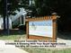Townside Terrace Condominiums sign with lush landscaping and residential building in the background at 511 Hillsborough St # Bldg B 106, Chapel Hill, NC 27514