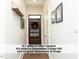 Hallway leads to a wooden front door at 511 Hillsborough St # Bldg B 106, Chapel Hill, NC 27514