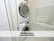 Efficient laundry area with stacked washer and dryer for space-saving convenience at 511 Hillsborough St # Bldg B 106, Chapel Hill, NC 27514