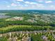 Aerial view of the community and golf course, highlighting its proximity to local amenities at 521 Morning Oaks Dr, Holly Springs, NC 27540