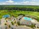 An aerial view of community amenities including the pool, golf course, and tennis courts at 521 Morning Oaks Dr, Holly Springs, NC 27540