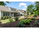 A backyard showcases a screened porch, patio area, and mature landscaping at 521 Morning Oaks Dr, Holly Springs, NC 27540