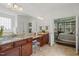 Elegant bathroom with granite countertops, double sinks, and vanity seating area at 521 Morning Oaks Dr, Holly Springs, NC 27540