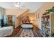 A quaint bedroom features a ceiling fan, artwork, and a large decorative oriental screen at 521 Morning Oaks Dr, Holly Springs, NC 27540