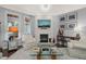 Bright and airy living room featuring a fireplace, elegant decor, and comfortable seating, creating a welcoming space at 521 Morning Oaks Dr, Holly Springs, NC 27540