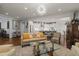 Bright living space with elegant furnishings and decor, seamlessly connecting to the open-concept kitchen for modern living at 521 Morning Oaks Dr, Holly Springs, NC 27540