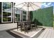 Outdoor dining area with table, chairs, umbrella, and a well-maintained patio, perfect for entertaining at 521 Morning Oaks Dr, Holly Springs, NC 27540