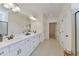 Bright bathroom with double vanity, white cabinets, quartz countertops, and walk-in shower at 522 Olivia Crossing Ct # 18, Four Oaks, NC 27524