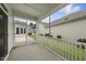 Screened-in back porch with view of adjacent buildings and a screen door at 537 Bramble Ln, Clayton, NC 27527