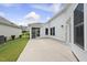 Concrete patio with access to well-manicured backyard and adjacent buildings at 537 Bramble Ln, Clayton, NC 27527