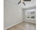 Cozy bedroom with neutral walls, hardwood floors, window with blinds and ceiling fan at 537 Bramble Ln, Clayton, NC 27527