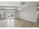 Bright dining area features gray walls, hardwood floors, and backyard access at 537 Bramble Ln, Clayton, NC 27527