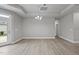 Bright dining area features gray walls, hardwood floors, and modern light fixture at 537 Bramble Ln, Clayton, NC 27527