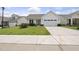 Beautiful single-Gathering home with green grass, lovely landscaping, and an attached garage at 537 Bramble Ln, Clayton, NC 27527