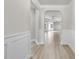Elegant foyer with arched doorways and wood-look flooring leading to a spacious living area at 537 Bramble Ln, Clayton, NC 27527