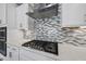 Gourmet kitchen with gas cooktop and custom tile backsplash at 537 Bramble Ln, Clayton, NC 27527