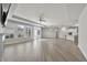 Expansive open-concept living room features hardwood floors, a ceiling fan, and natural light at 537 Bramble Ln, Clayton, NC 27527