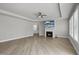 Bright living room with fireplace, ceiling fan, and hardwood floors at 537 Bramble Ln, Clayton, NC 27527