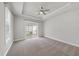 Spacious bedroom with tray ceilings, neutral carpet, and sliding glass doors to the backyard at 537 Bramble Ln, Clayton, NC 27527