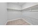 Ample shelving and storage space in this well-organized walk-in closet at 537 Bramble Ln, Clayton, NC 27527