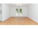Dining room featuring hardwood floors and double doors leading to a deck, perfect for entertaining at 5429 Fortunes Ridge Dr, Durham, NC 27713