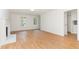 Bright living room showcasing hardwood floors and a decorative fireplace, offering a cozy and inviting atmosphere at 5429 Fortunes Ridge Dr, Durham, NC 27713