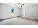 This bedroom features light gray walls with elegant trimwork and plush gray carpeting at 5500 Lake Wendell Rd, Zebulon, NC 27597