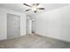 Bedroom features carpet, a ceiling fan, a large closet, and neutral paint for versatile décor at 5500 Lake Wendell Rd, Zebulon, NC 27597