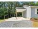 This outdoor carport has a concrete floor and gray siding at 5500 Lake Wendell Rd, Zebulon, NC 27597